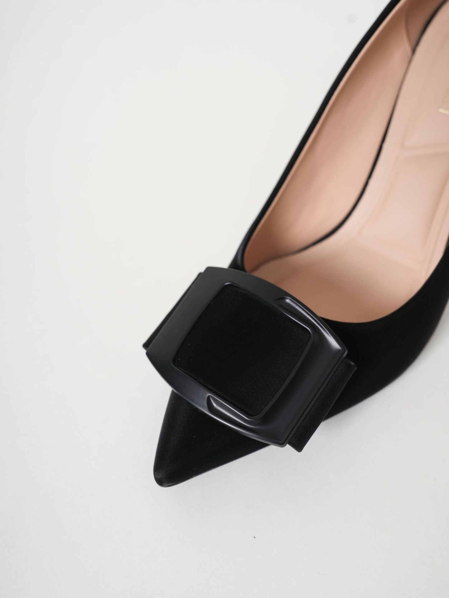 Mescini black pointed toe stiletto pumps, close up of the square plate ornament, US women's sizes