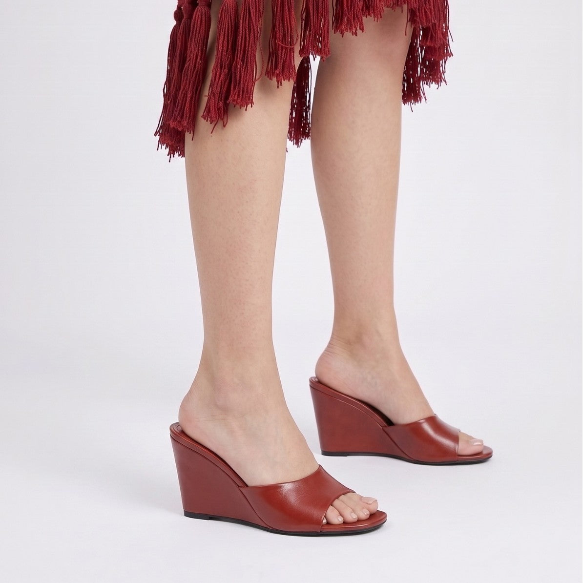 Mescini – red wedge mules worn standing, full wedge profile view, US women's sizes