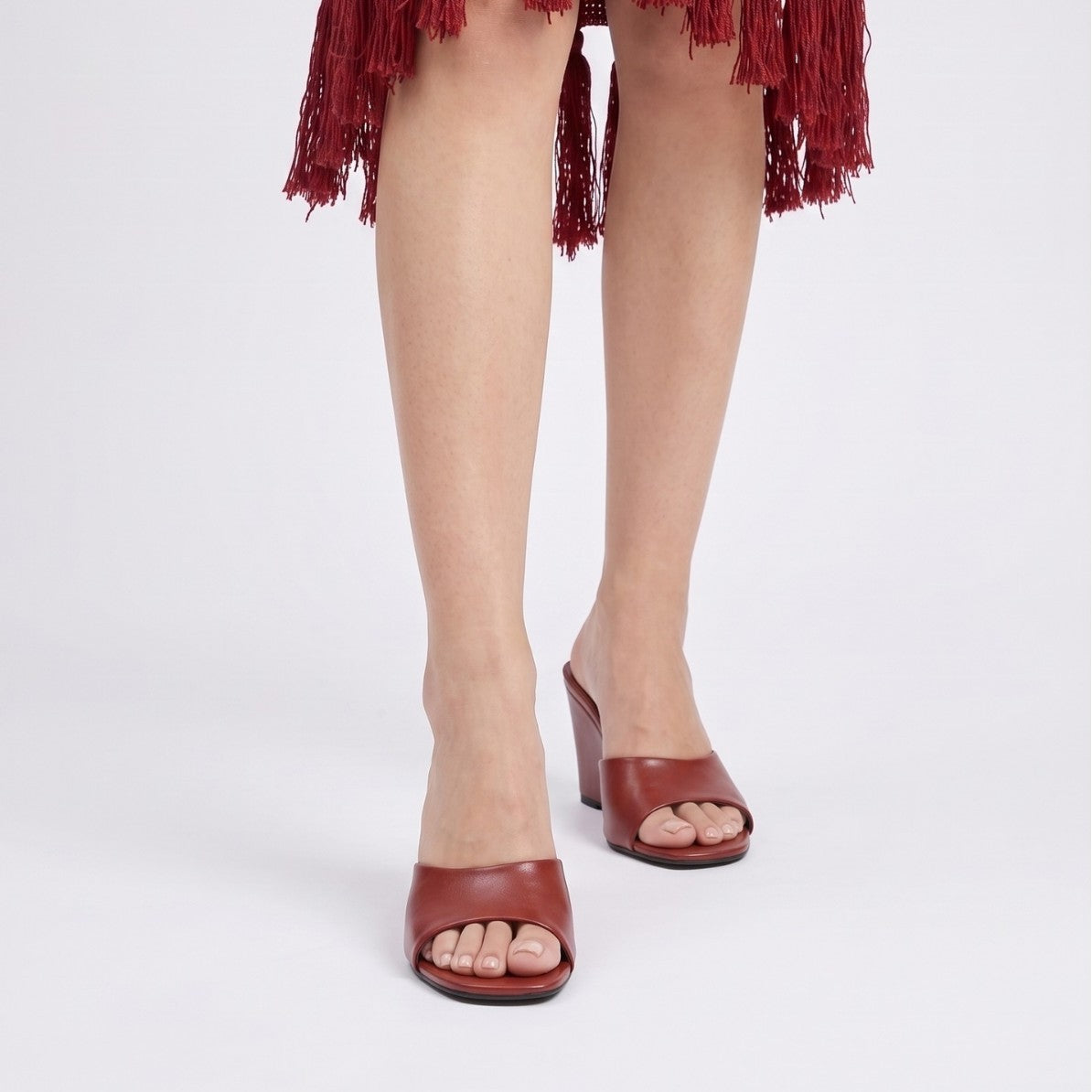 Mescini – red wedge mules worn from the front, toe band detail, US women's sizes