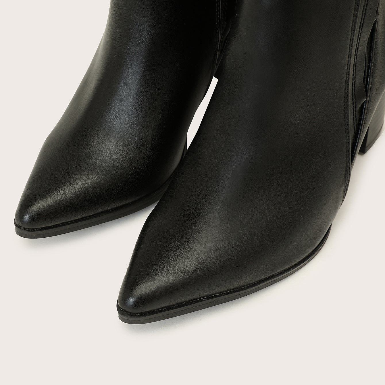 Mescini black chelsea boots, close view of the two long pointed toes side by side