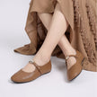 Mescini - camel mary jane flats worn seated, gold button strap, US women's sizes