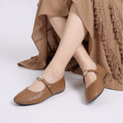 Mescini - camel mary jane flats worn seated, gold button strap, US women's sizes