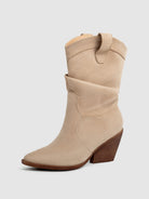 Mescini apricot slouch suede western cowboy boots, front three quarter view on grey, US women's sizes
