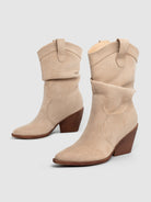 Mescini apricot slouch suede western cowboy boots, pair angled on a plain grey backdrop, US women's sizes