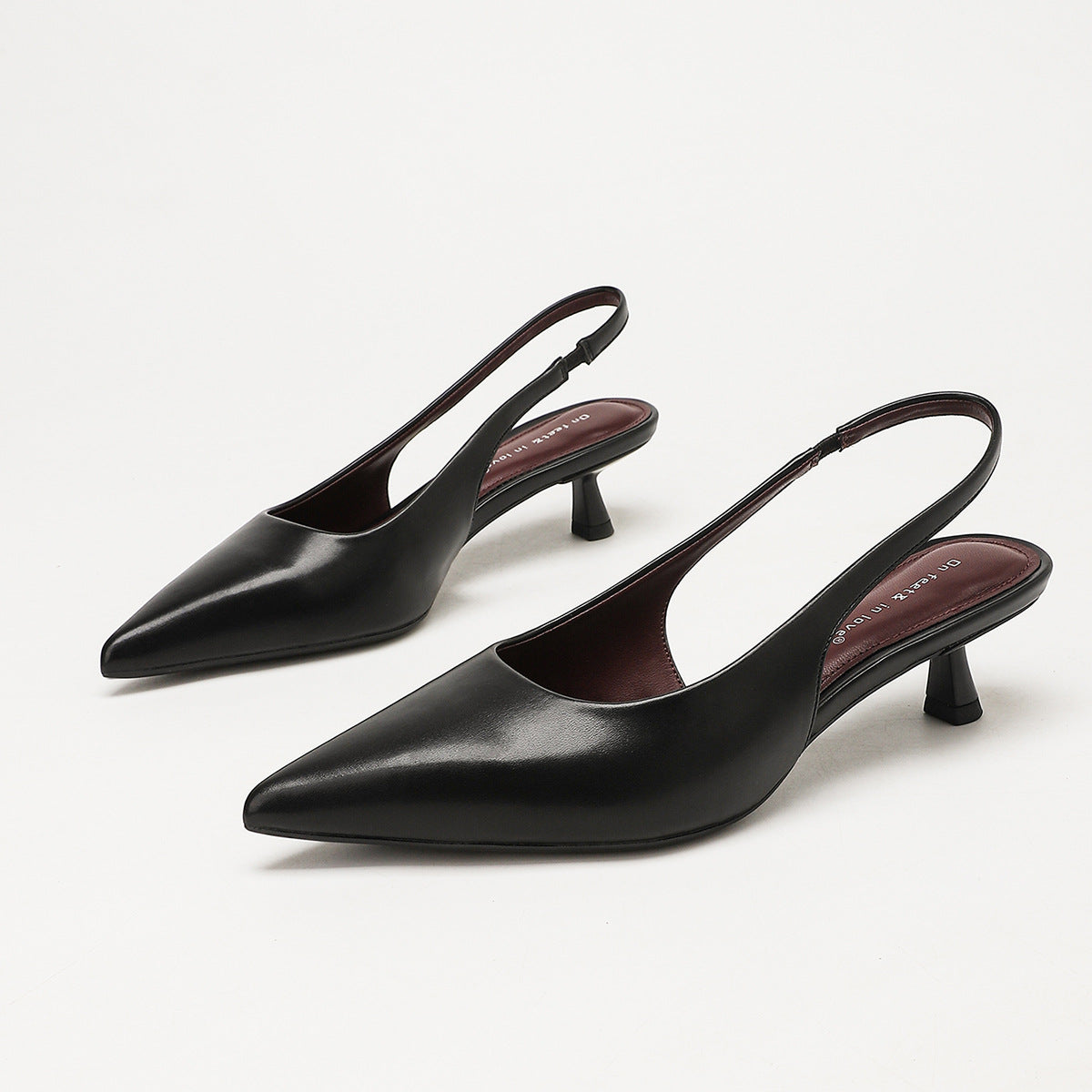 Mescini – black slingback kitten heels, angled front view of the pair, US women's sizes