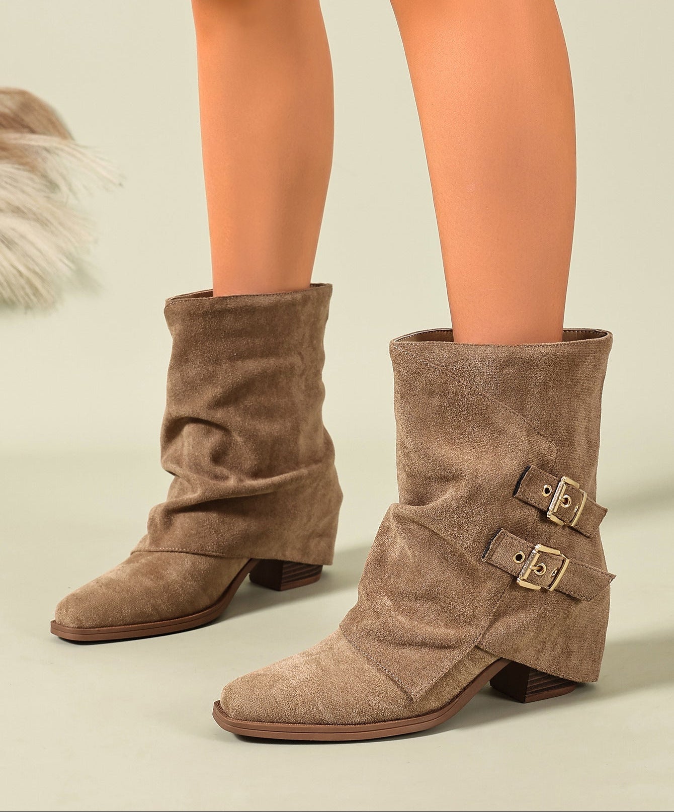 Mescini khaki ruched buckle mid calf slouch boots worn on the model legs, US women's sizes