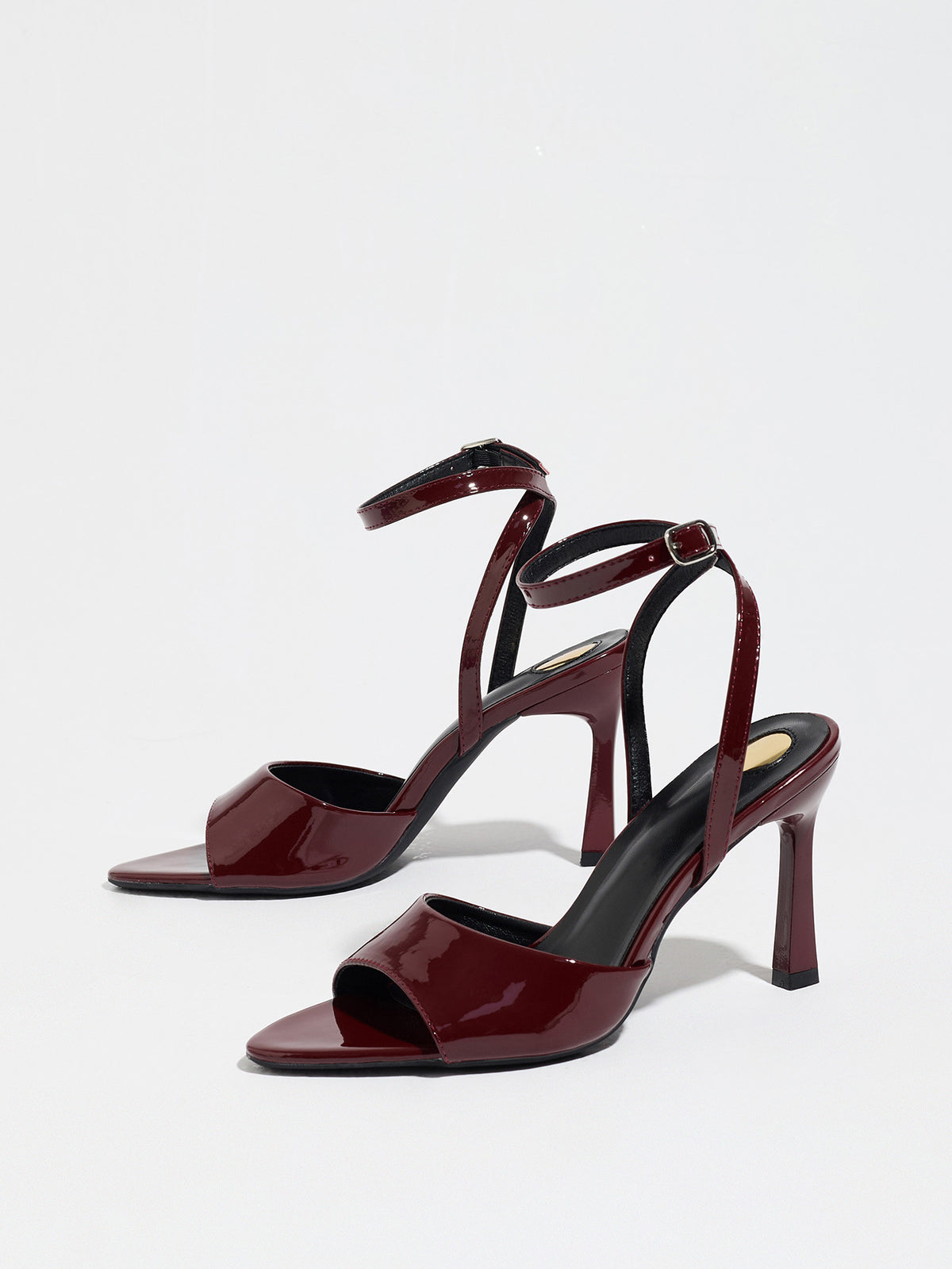 Mescini burgundy single band ankle strap sandals, the pair standing at an angle, US women's sizes