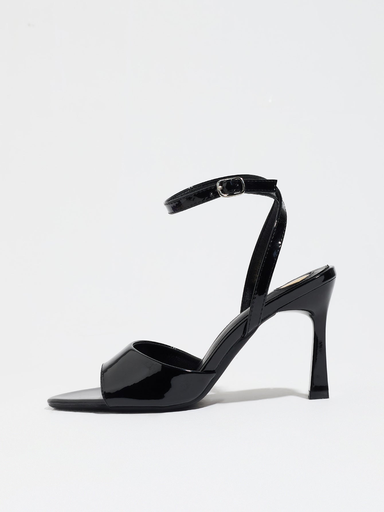 Mescini black single band ankle strap sandals, side profile of one shoe on white, US women's sizes