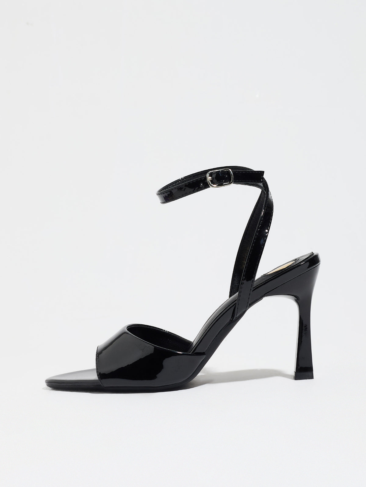 Mescini black single band ankle strap sandals, side profile of one shoe on white, US women's sizes