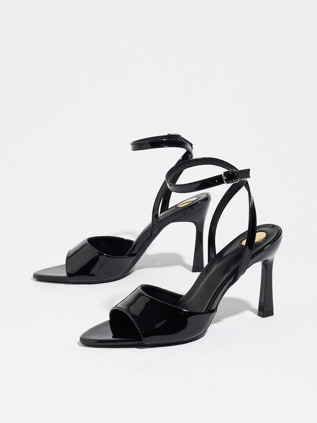 Mescini black single band ankle strap sandals, the pair standing at a slight angle, US women's sizes