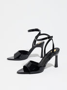 Mescini black single band ankle strap sandals, the pair standing at a slight angle, US women's sizes
