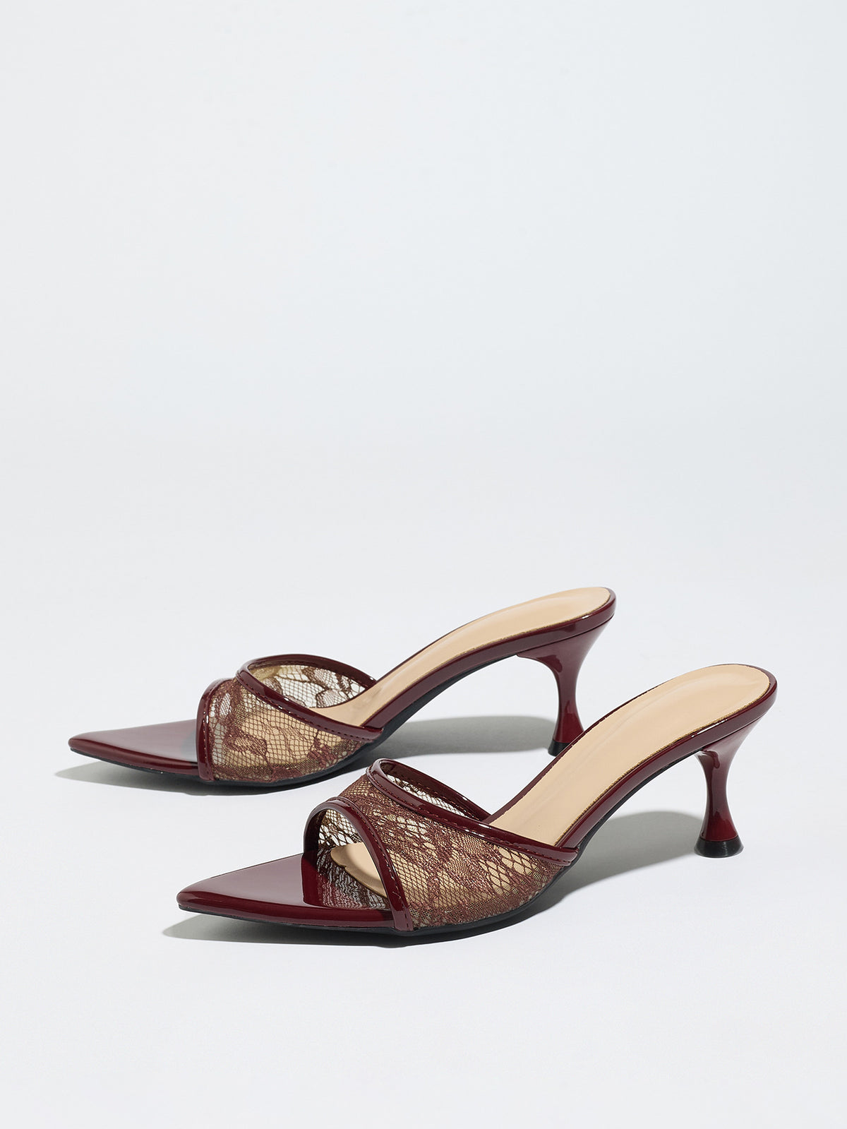 Mescini burgundy sheer lace pointed toe mule heels, angled pair on a pale backdrop, US women's sizes