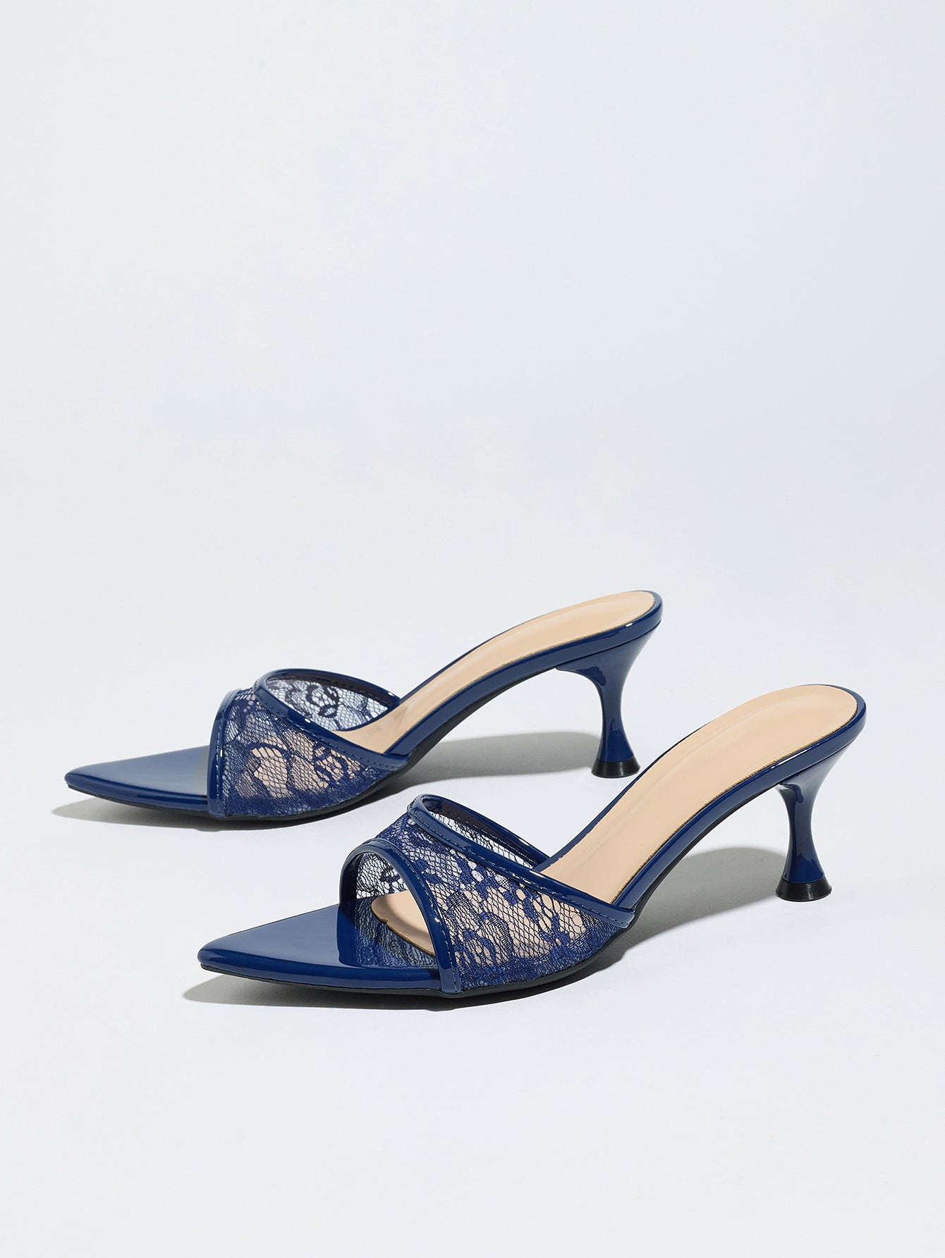 Mescini navy sheer lace pointed toe mule heels, angled pair on a pale grey backdrop, US women's sizes