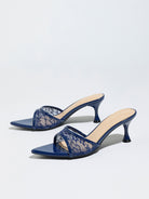 Mescini navy sheer lace pointed toe mule heels, angled pair on a pale grey backdrop, US women's sizes