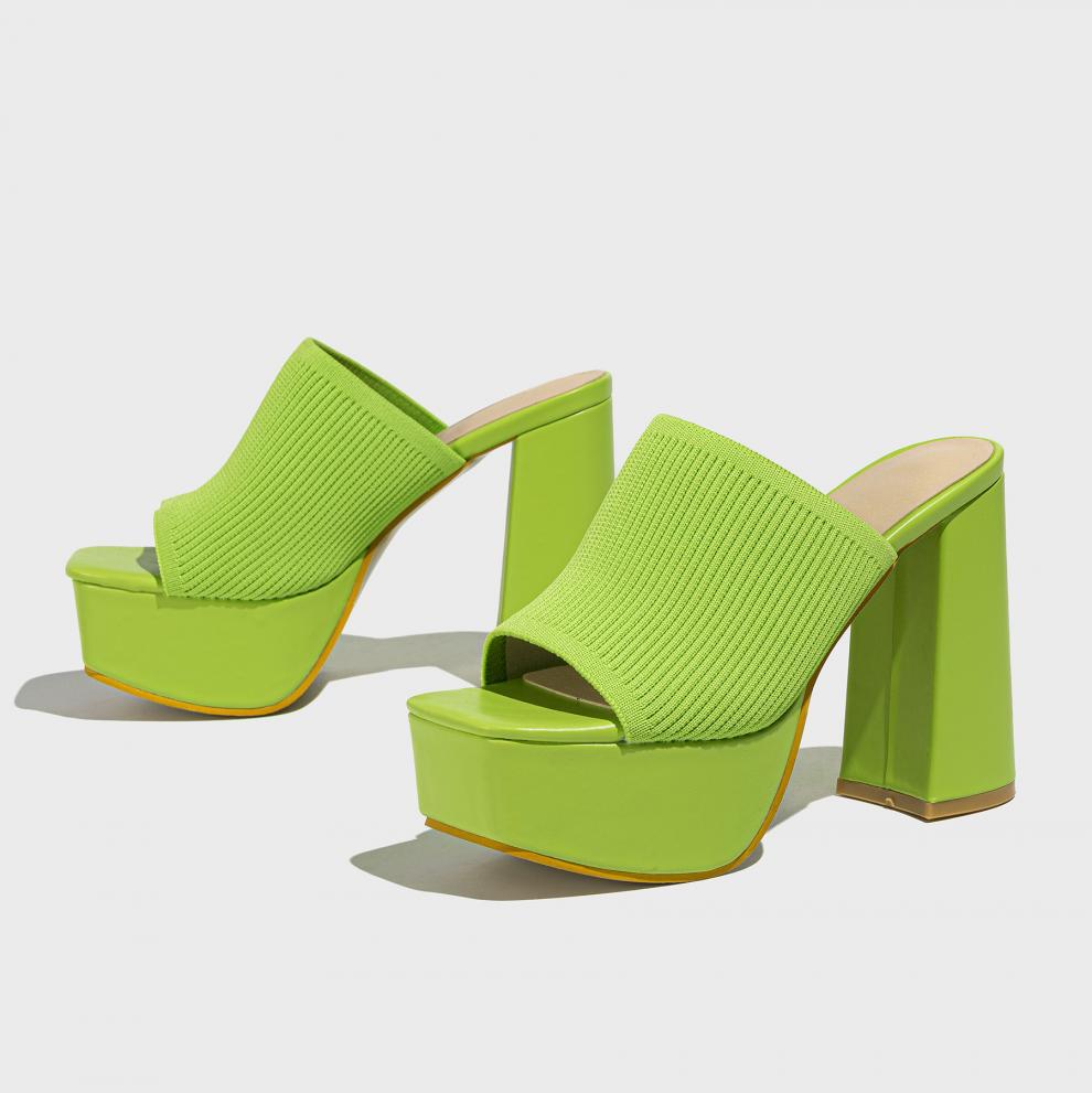 Mescini green knit band platform mule heels, angled pair on a pale grey floor, US women's sizes