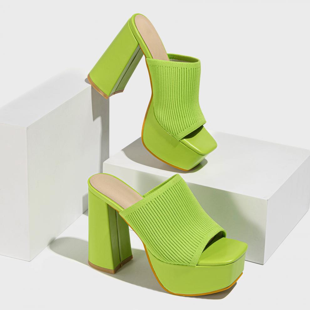 Mescini green knit band platform mule heels, pair staged on white blocks in the studio, US women's sizes