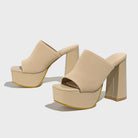 Mescini beige knit band platform mule heels, angled pair on a light grey surface, US women's sizes