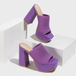 Mescini purple knit band platform mule heels, pair staged on a white block and riser, US women's sizes