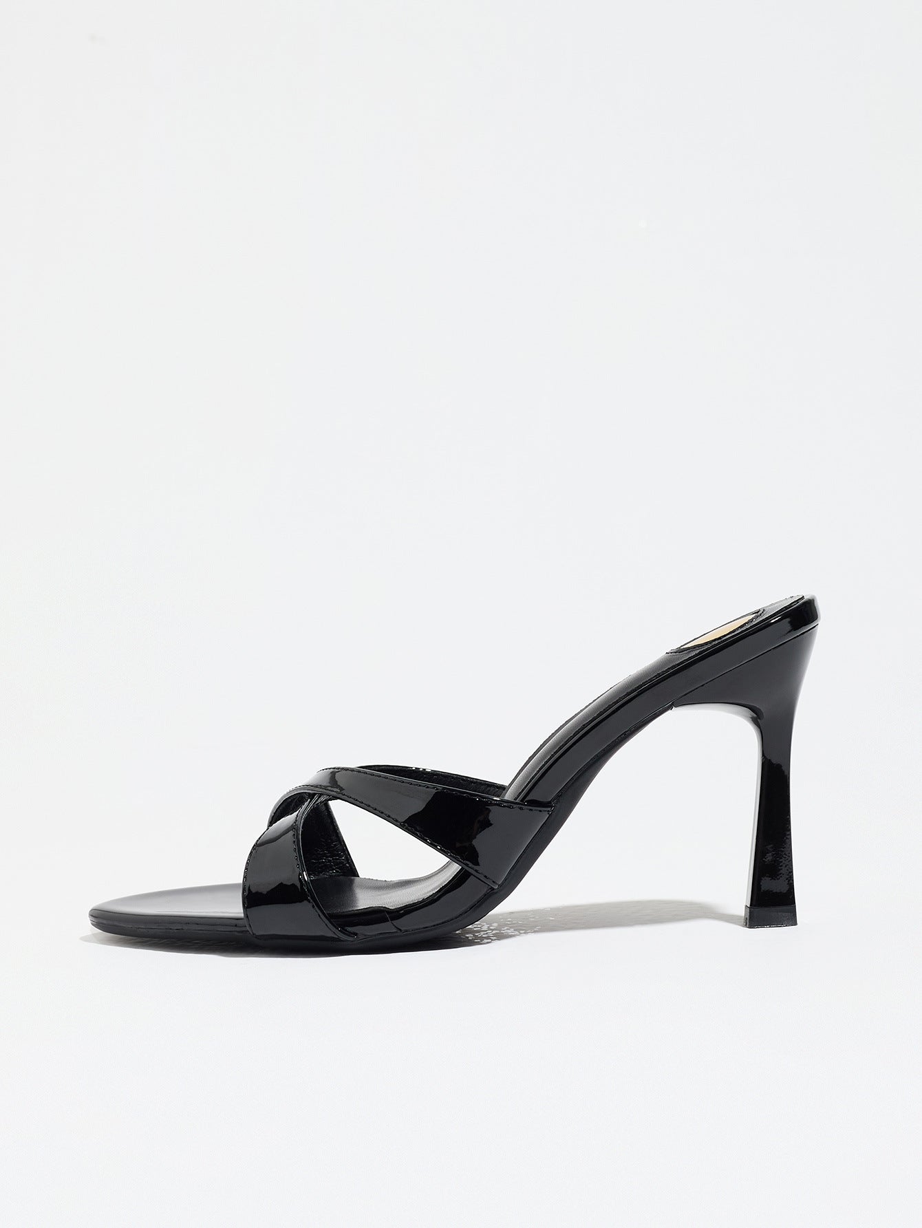 Mescini black cross strap stiletto mule sandals, single shoe in full side view, US women's sizes