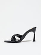 Mescini black cross strap stiletto mule sandals, single shoe in full side view, US women's sizes