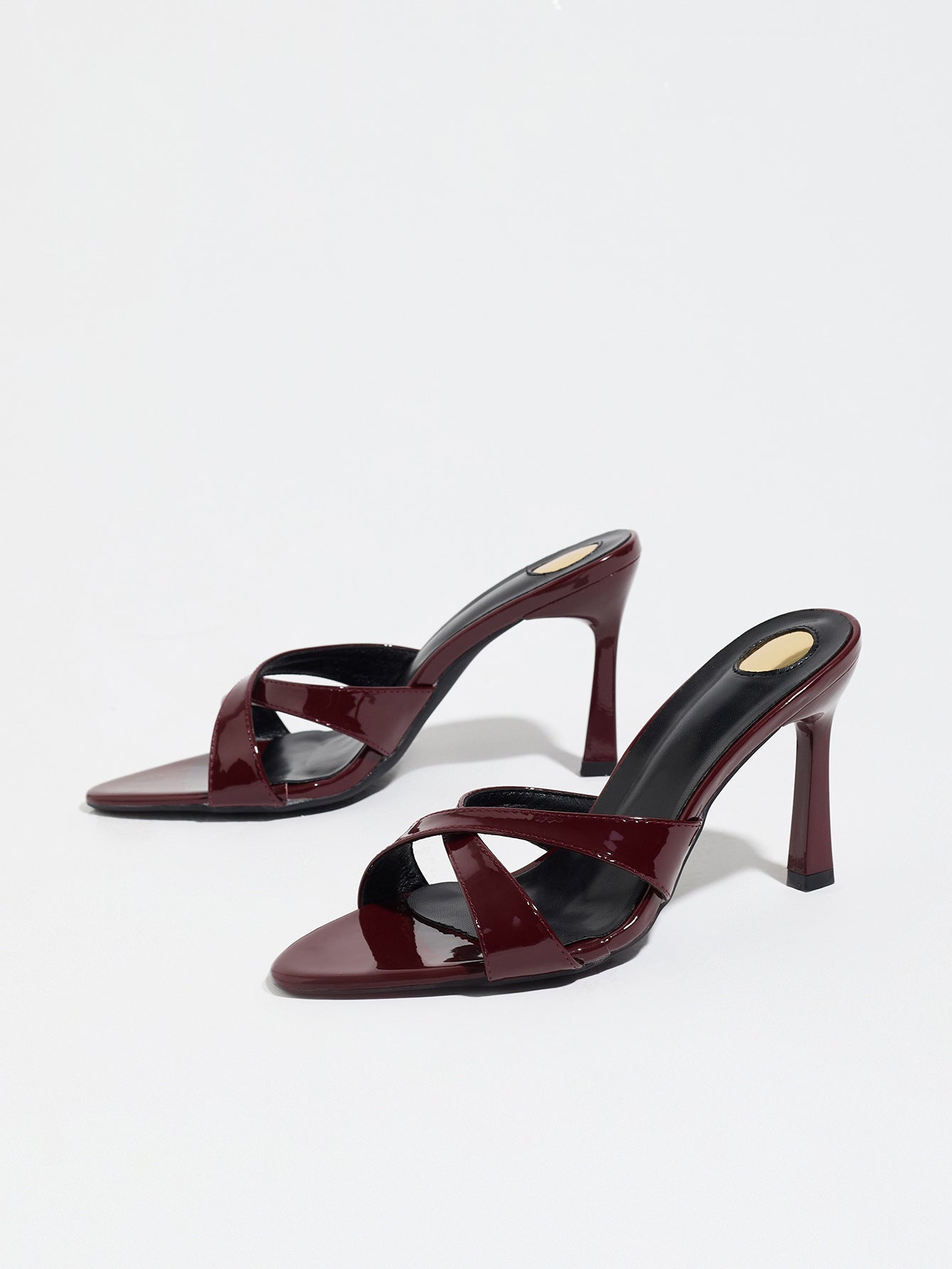 Mescini burgundy cross strap stiletto mule sandals, pair seen from the front, US women's sizes