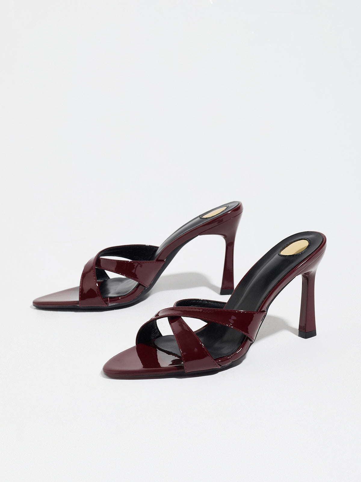 Mescini burgundy cross strap stiletto mule sandals, pair seen from the front, US women's sizes