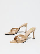 Mescini nude cross strap stiletto mule sandals, pair from a low front angle, US women's sizes