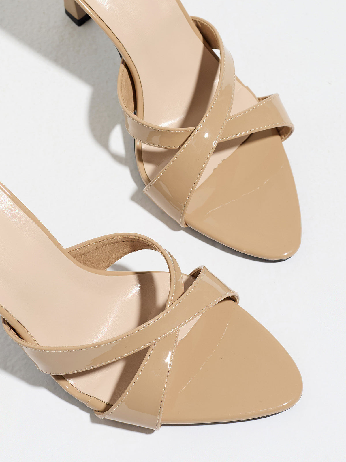 Mescini nude cross strap stiletto mule sandals, close up of the crossed vamp straps, US women's sizes