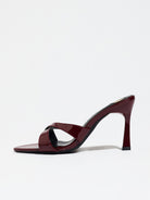Mescini burgundy cross strap stiletto mule sandals, single shoe side profile, US women's sizes