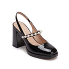 Mescini black pearl strap platform mary jane heels, one shoe photographed from the side, US women's sizes