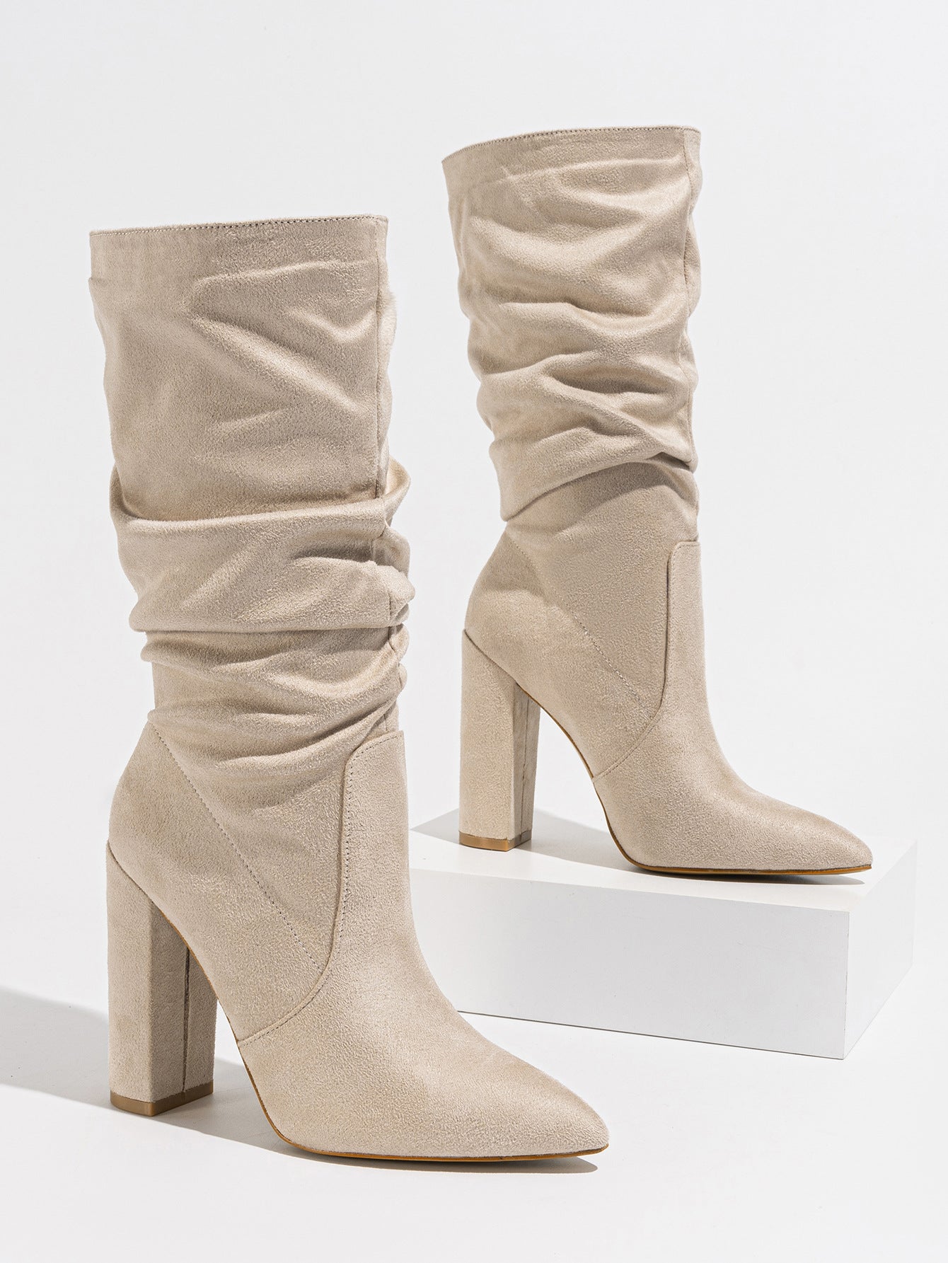 Mescini beige slouchy suede knee high boots, pair posed on a white block, US women's sizes