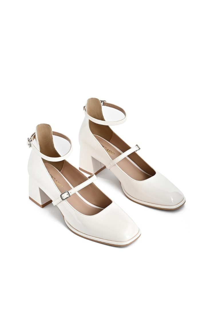 Mescini white square toe block heel mary janes, angled pair standing on a pale surface, US women's sizes