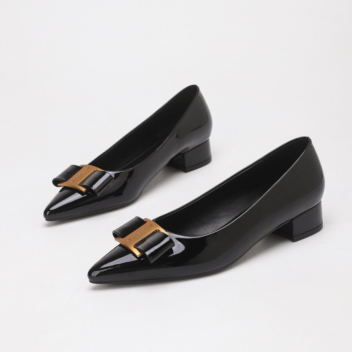 Mescini – black pointed toe low block heel pumps with gold bow, pair view, US women's sizes
