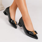 Mescini – black pointed toe pumps on foot showing the low block heel, US women's sizes shown