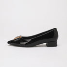 Mescini – black bow pump in side profile with the gold plate detail, US women's sizes shown